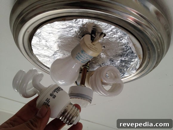 Switch to Energy-Saving Lightbulbs This Year: What to Know 2 changing-lightbulbs-cfl.jpg
