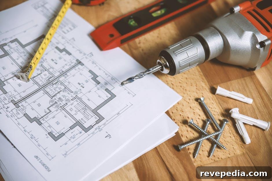 Renovation site in a Southern US home with architectural blueprints and tools laid out