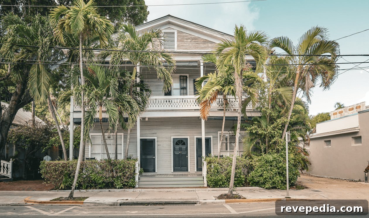 How to Strengthen Your Home to Survive Severe Storms 3 White house with palm trees, ready for a