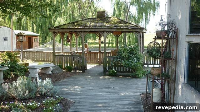 Essential Things to Know Before Building Your Backyard Deck 3 Wooden walkway next to a backyard gazebo