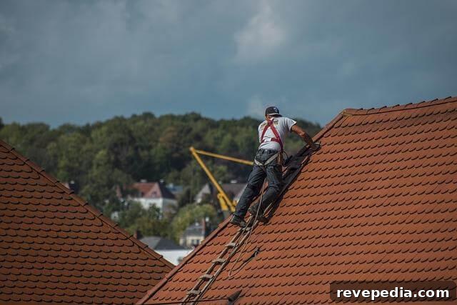 Flashing Leak Repair Guide: Identify Causes and Fixes 3 Man on ladder fixing a roof to prevent flashing leaks