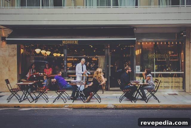 Memorable Commercial Interiors: Restaurants, Boutiques & Hotels Designed to Impress 4 People dining at tables outside a restaurant