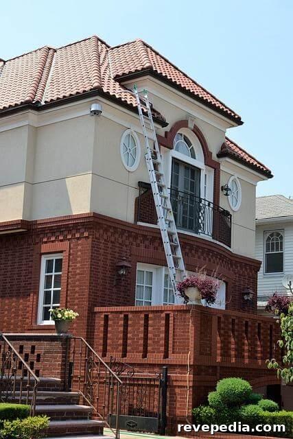 Why You Need Routine Home Inspections Before Buying or Selling 2 Ladder attached to a brick home during