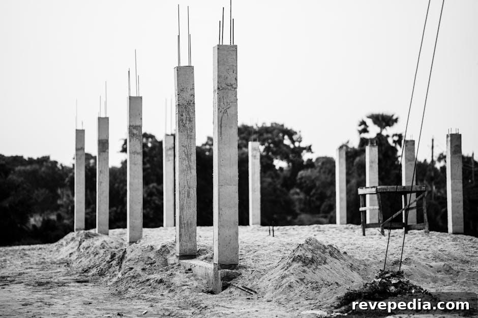 Helical Piles Explained: Faster Foundation Installation Guide 2 A steel helical pile being installed in the ground