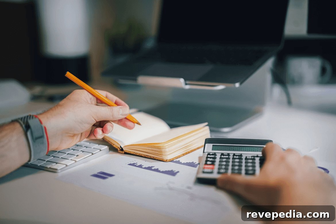 Home Renovation Budgeting: Plan, Save, and Finance Your Upgrades 2 A person calculating renovation budget on a desk with