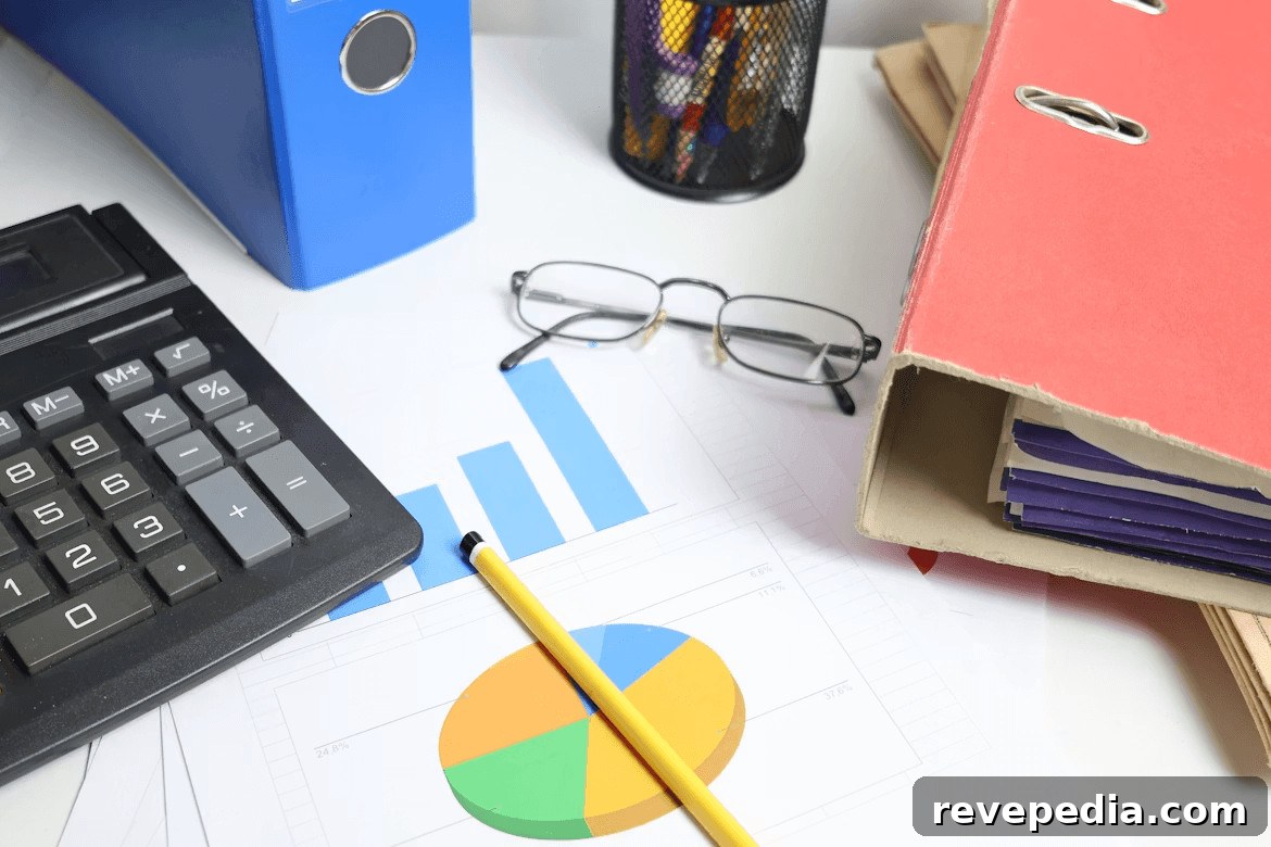 Creative Strategies to Save a Down Payment for Your First Home 2 Desk with calculator, pen, glasses, and