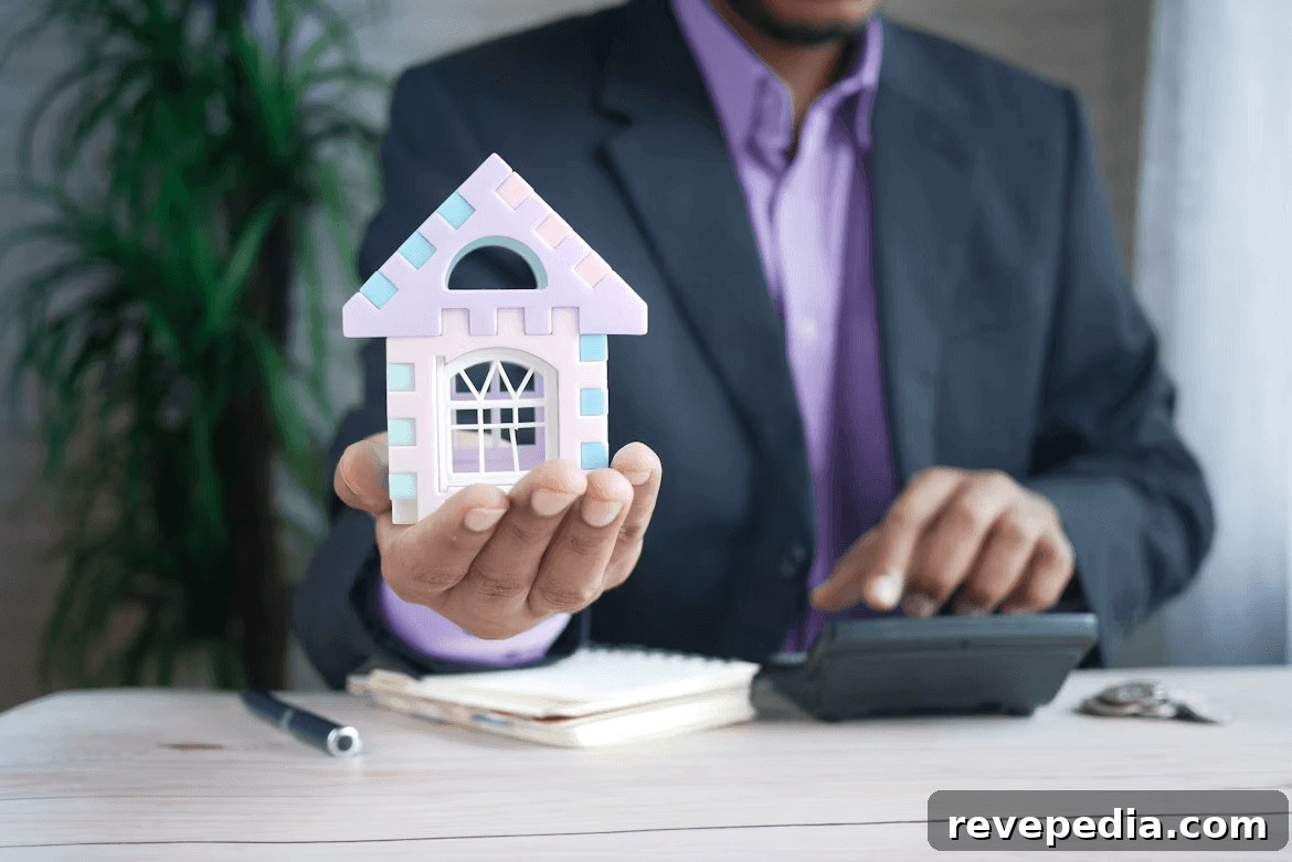 Creative Strategies to Save a Down Payment for Your First Home 3 Man in suit holding toy house, symbolizing first