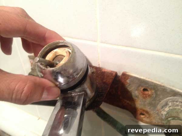 Stop a Dripping Kitchen Faucet: Quick Fixes and Tips 4 remove-cap