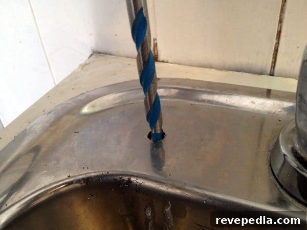 Install an Under-Sink Water Filter System: Step-by-Step Guide 5 drilling-stainless-steel