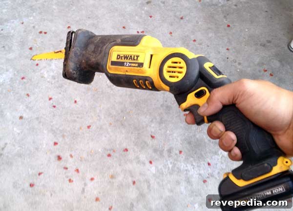 Replace a Broken Sprinkler Head: Step-by-Step Repair Guide 7 dewalt-pivot-recip-saw