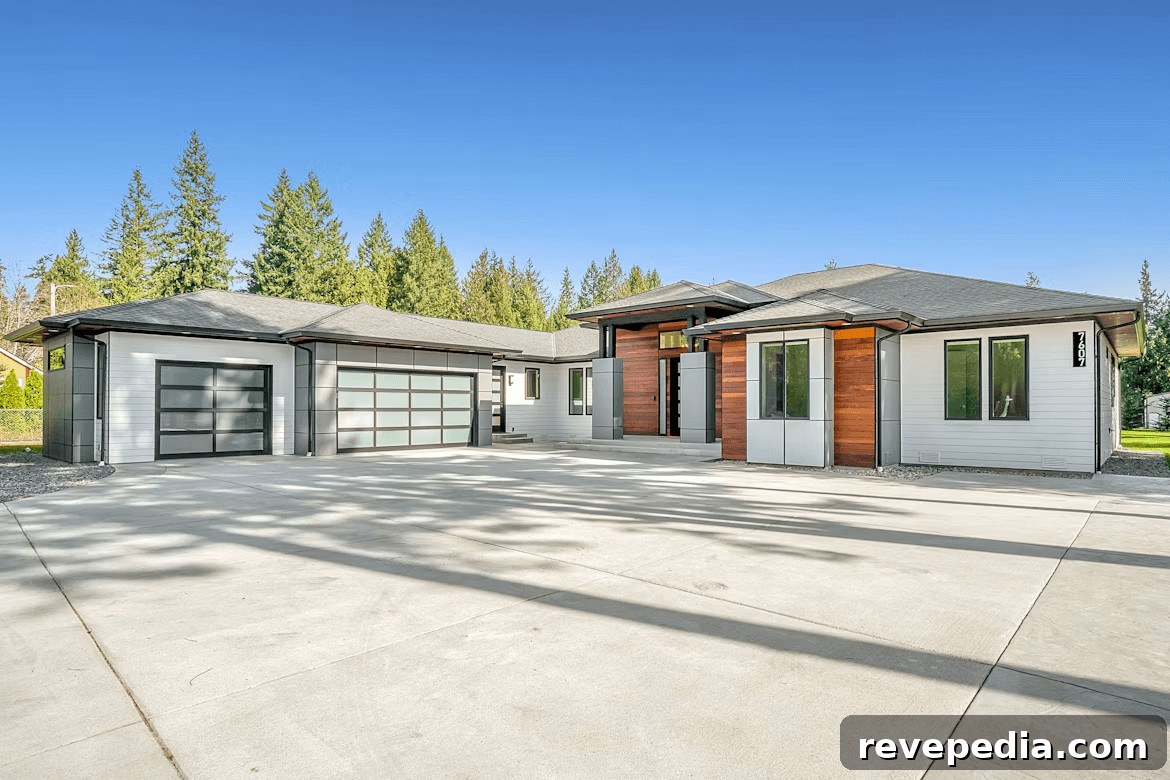 House with a large driveway and garage