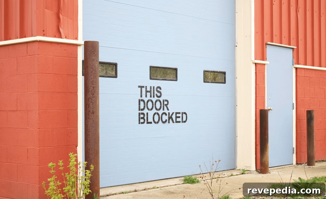 High-Speed Garage Doors for Industrial and Commercial Facilities 2 A blue and red industrial building with a