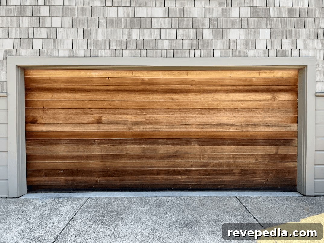 Wooden garage door on a brick home