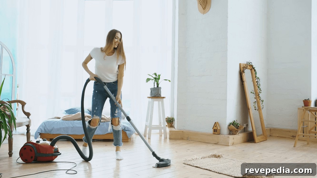 How Regular Home Carpet Cleaning Improves Indoor Air 3 Woman vacuuming a bed for domestic cleanliness