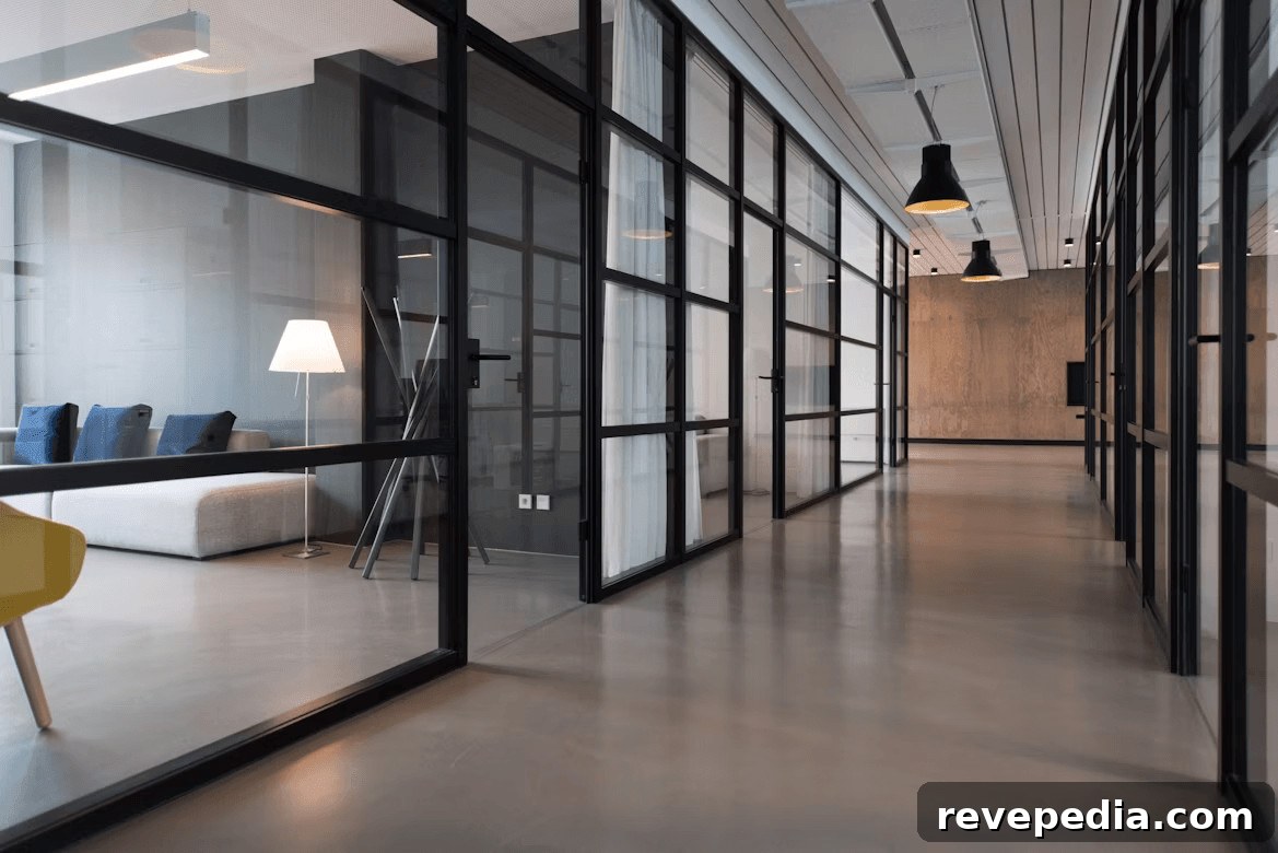 Long hallway featuring custom steel glass partitions and a yellow