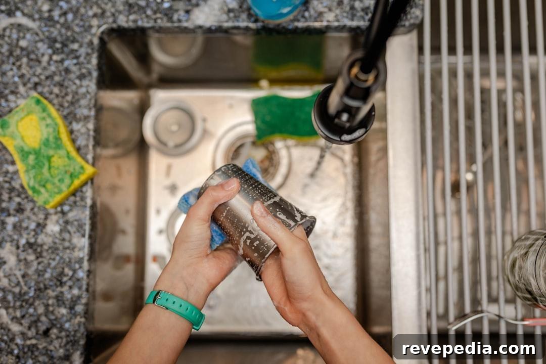 When Your DIY Repairs Exceed Your Skills and Budget 3 A person kneeling to repair a pipe under a sink using a hand wrench