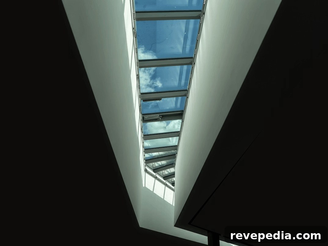 Why Homeowners Prefer Tubular Skylights for Modern Homes 2 View of blue sky through a modern building window