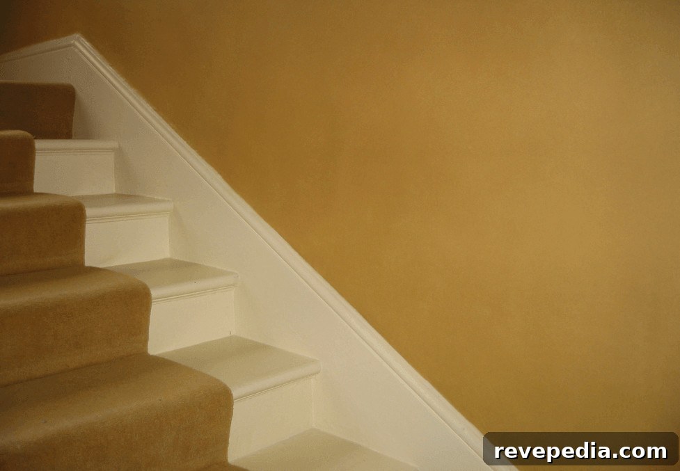 7 Reasons Mohawk Carpet Lasts Longer Than Other Brands 3 White staircase with yellow wall, mohawk carpet