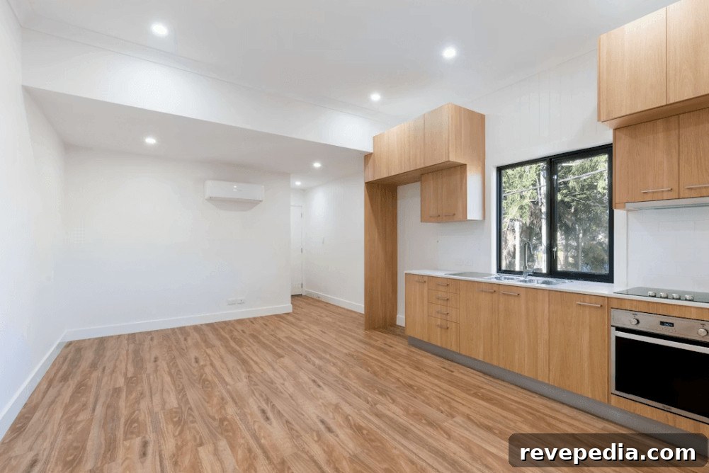 Final Inspection Checklist for Renters: Prepare Your Rental 2 Empty kitchen with wood floors and white walls for final