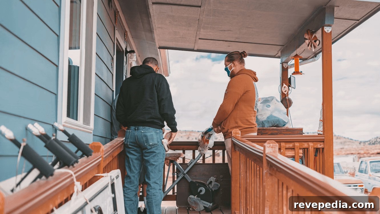 Two men standing on a wooden porch Two men standing on a wooden porch