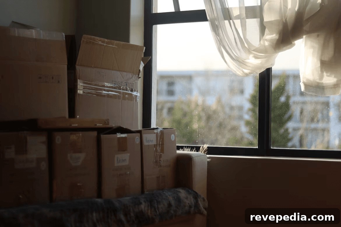 Stacked moving boxes on the floor in a new home