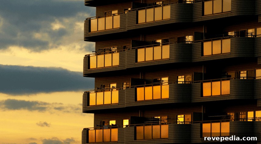 A Kansas City high-rise building with lit balconies