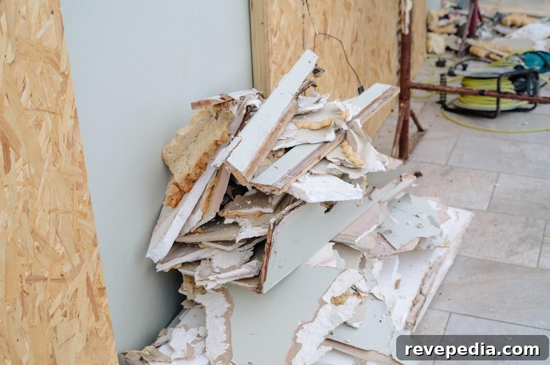 Pile of broken drywall and construction debris