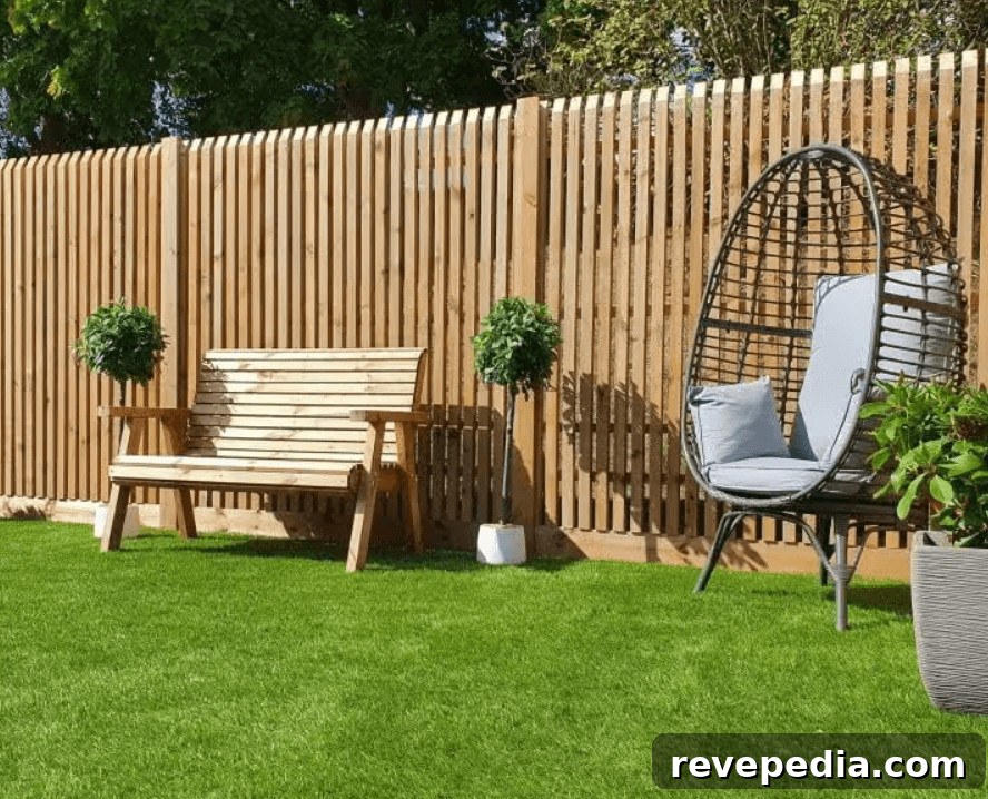Well-maintained wooden garden fence with a chair